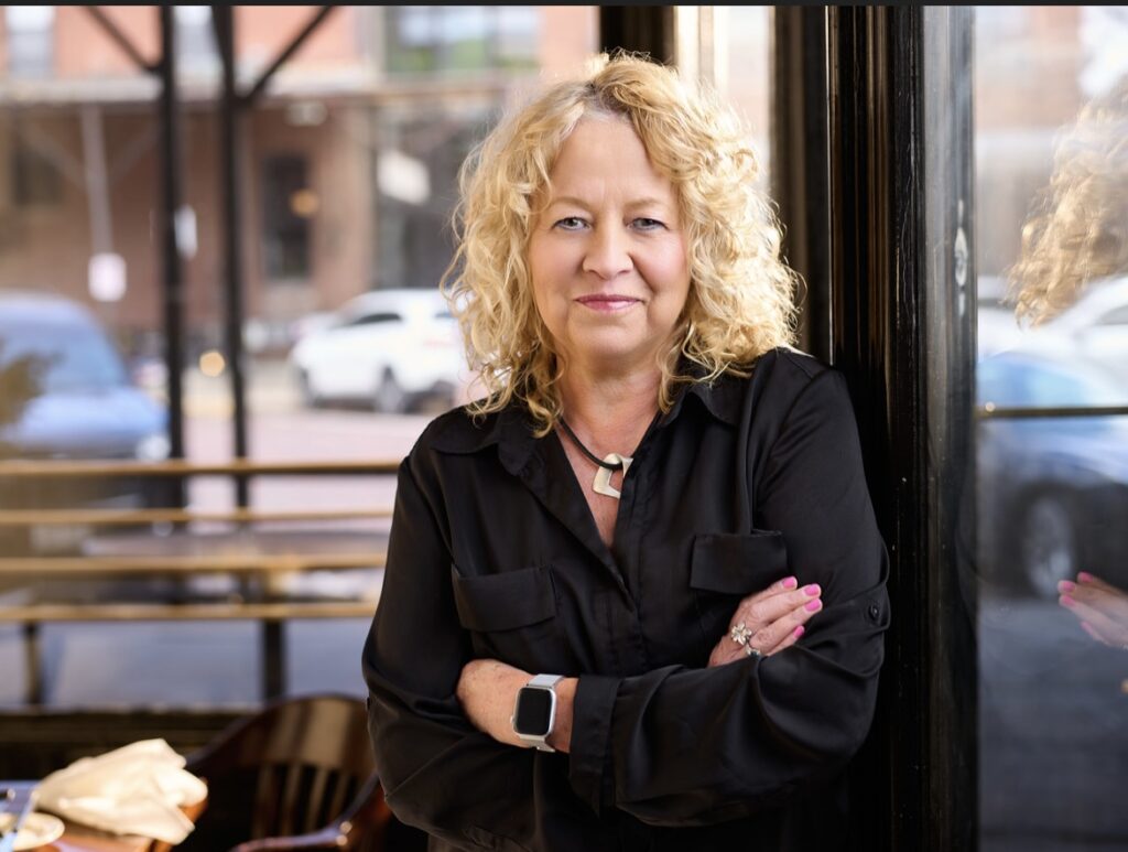 diane watson with arms crossed